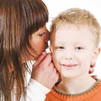 mother and son whispering